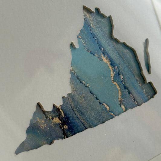 Blue and gold abstract painting on a white background